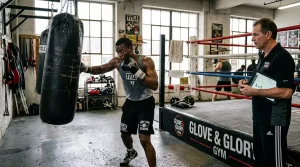 Boxer training in camp with coaching staff while pre-fight data and reports are reviewed
